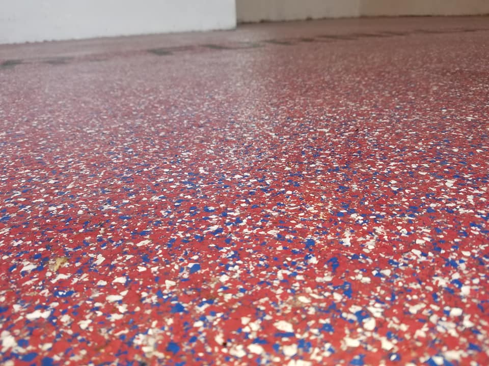 red, white and blue floor coating flecks
